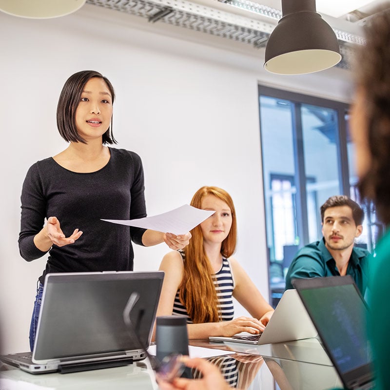 A woman talking in a meeting